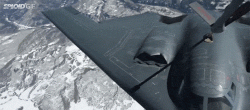 Watch a B-2 bomber refuel and then make its fuel receptacle disappear