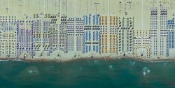 the beach at Viareggio, Italy, with umbrellas perfectly spread along the sand.