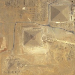 In this image the Pyramids of Giza, on the outskirts of Cairo, are transformed into almost two-d ...