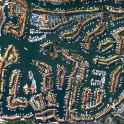 the Venetian-style channels of Port Grimaud, a seaside town on the French Riviera by the Gulf of ...