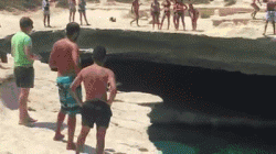 Dog shows cliff divers how it’s done