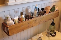 A bathroom organizer made from CD organizer.