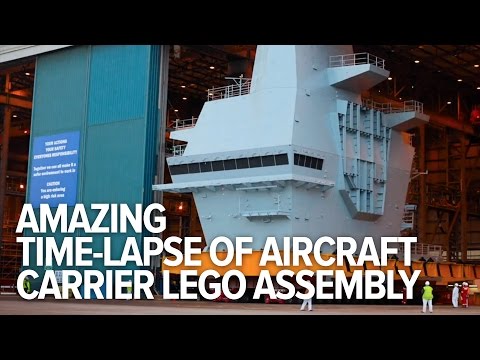 Amazing time-lapse of aircraft carrier Lego-like assembly – YouTube