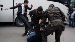 An aide to Turkey’s president kicked a protester. Then photos of the assault started disappearing.