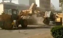 Bulldozers battle it out on Chinese street as rival firms clash | World news | The Guardian