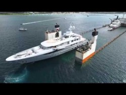 Great aerial Footage of DYT vessel Super Servant 4’s  float-on yacht transport method in M ...