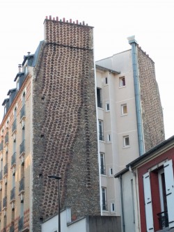 You can see the chimneys’ ducts of each floor from the side of this old building