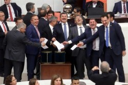 AKP lawmakers laugh as they cast their votes to remove parliamentary immunity from only the Kurd ...