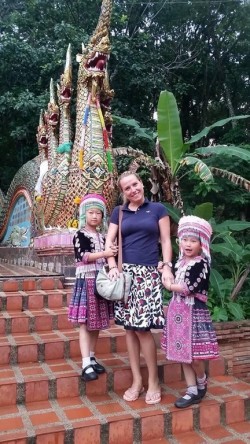 Woman in the process of having her watch stolen in Thailand