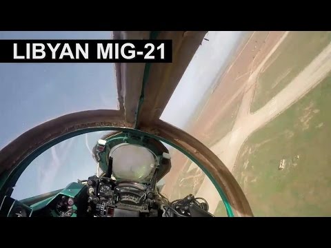 A Libyan Air Force MiG-21 passing very low over an airbase – YouTube