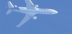 Super Strong Camera Zoom Gets Ridiculously Close to an Airplane Flying in the Air from the Ground