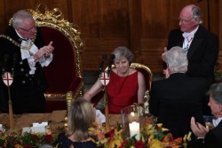 Theresa May condemns ‘global elite’ while surrounded by men in white tie, ermine, an ...
