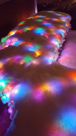 Christmas lights under the snow