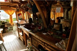 Check out the wooden detailing in this rustic bus conversion’s open-plan kitchen