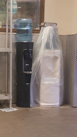 These water dispensers look like they’re getting married.