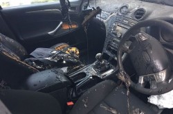Apple MacBook bursts into flames on the passenger seat and the driver says someone could have di ...