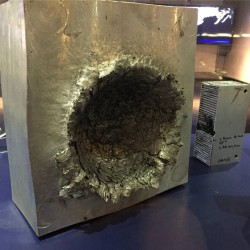 This is what happens to aluminium when a 1/2 oz piece of plastic hits it at 15,000 mph in space