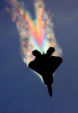 An F-22 Raptor pulling so many Gs the low pressure air over the fuselage gets cold enough for th ...