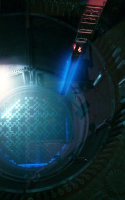 Cherenkov Radiation coming off a fresh fuel rod being lowered into a reactor.