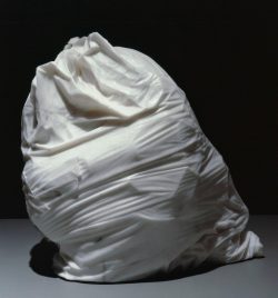 A marble statue of a trashbag