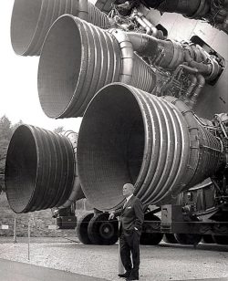 Dr Von Braun stands next to the F-1 engines of the Saturn V Dynamic test vehicle