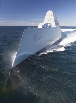 USS Zumwalt cutting through the water.