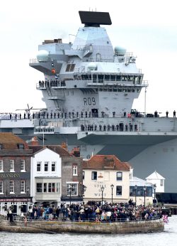 HMS Prince of Wales towering over Old Portsmouth