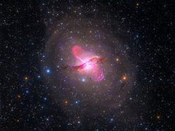 In a nearby galaxy, a supermassive black hole spews spectacular jets of material into space well ...