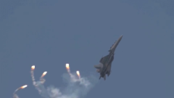 A Malaysian Su-30MKM rains flares