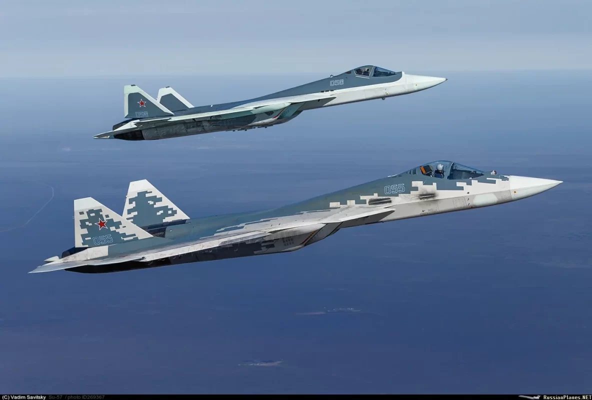 Two more stealthy Su-57s cruising side by side