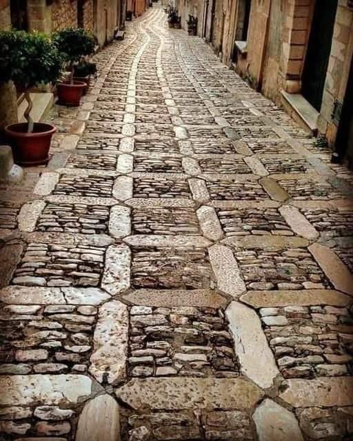 Ancient roman basalt road in western Sicily, Italy.