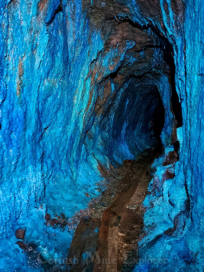 Looking down the amazing tunnel of blue in a 1850’s Cornish copper mine. This amazing leve ...