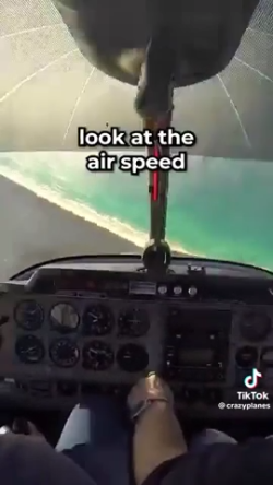 Flight instructor teaches student pilot how to recover from a spin