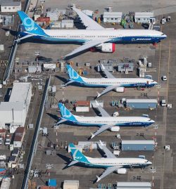 A great side-by-side comparison of the 777-9 and 737 MAX 7, 10 parked at Boeing Field.