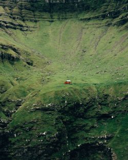 The Lonely Red House is a well-known and picturesque landmark located in the Faroe Islands, an a ...