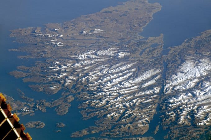 Scotland is hardly visible from space due to clouds. This is a rare photograph of the Scottish H ...