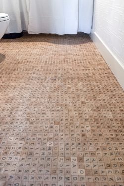 Whimsical scrabble flooring in the bathroom built by Cedric and Kathie Lo of Vancouver, Canada.  ...