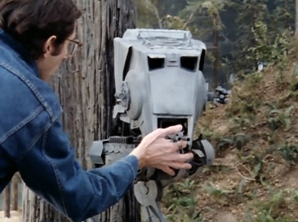 Outdoors at the ILM facility in San Francisco, Paul Huston makes an adjustment to the AT-ST Walk ...