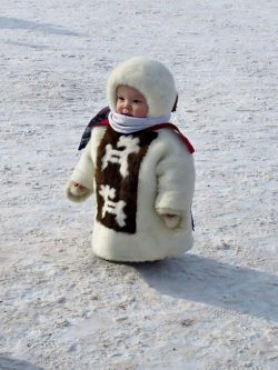 Sakha (”Yakut”) child in traditional winter dress, Siberia